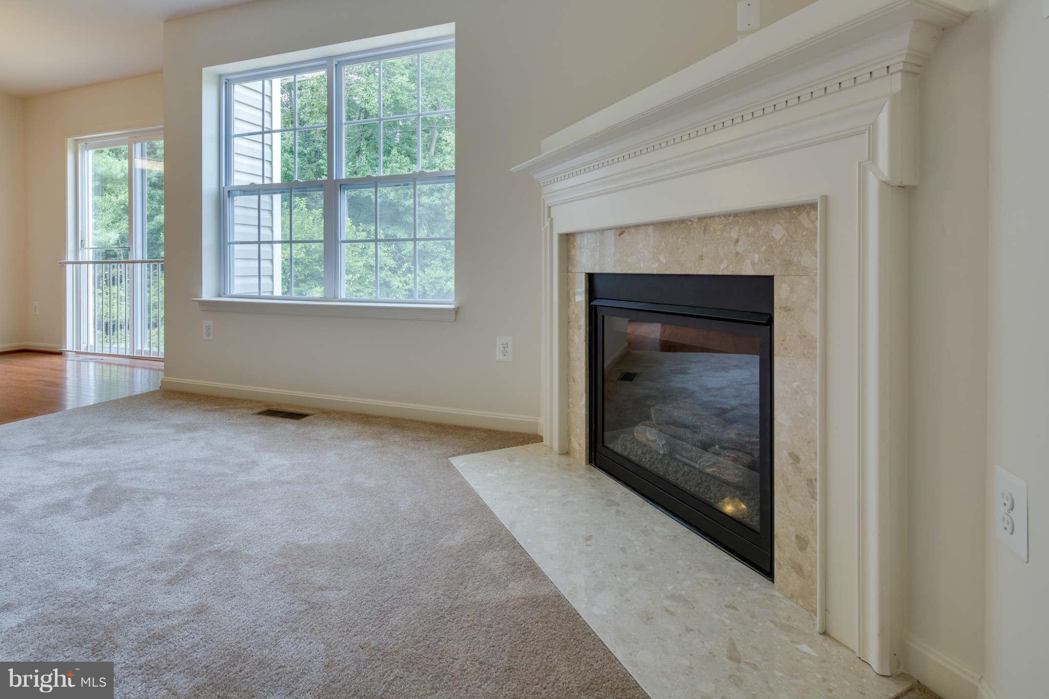 4 Hanover Road Hanover, MD 21076 - Photo 25 of 30 a view of an empty room with window and fire place