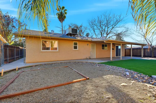 a view of a backyard with a garden and plants