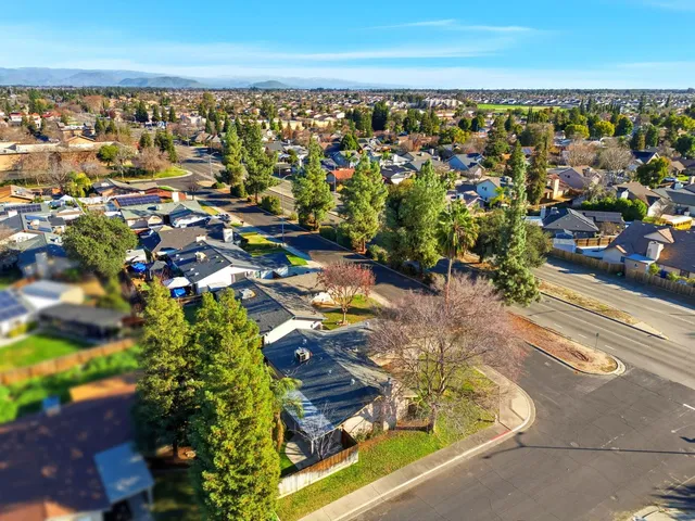 an aerial view of residential houses with outdoor space