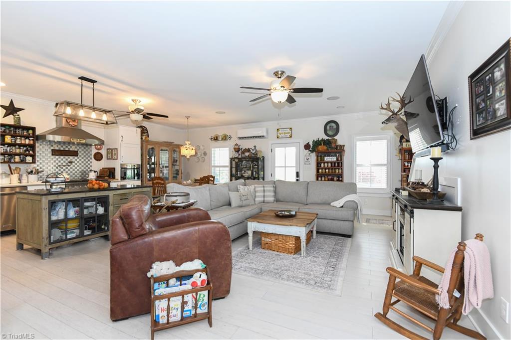 7164 Ludgate Road Gibsonville, NC 27249 - Photo 50 of 50 Open floor plan- kitchen-dining area- great room-view from laundry room
