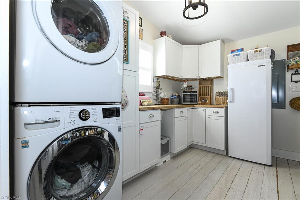 7164 Ludgate Road Gibsonville, NC 27249 - Photo 15 of 50 laundry room with pantry
