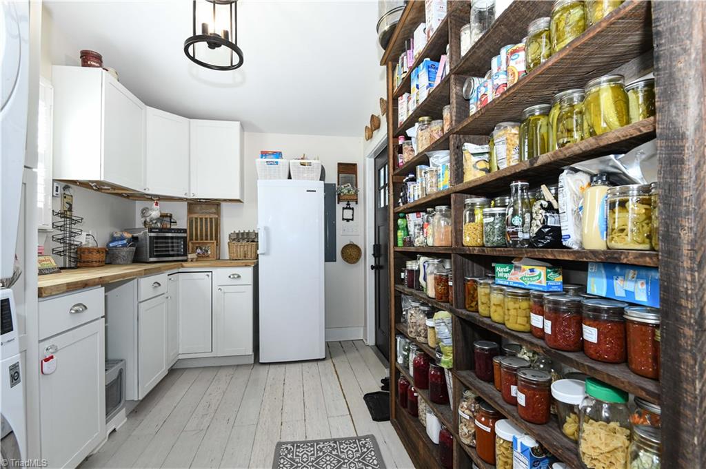 7164 Ludgate Road Gibsonville, NC 27249 - Photo 16 of 50 laundry room with pantry