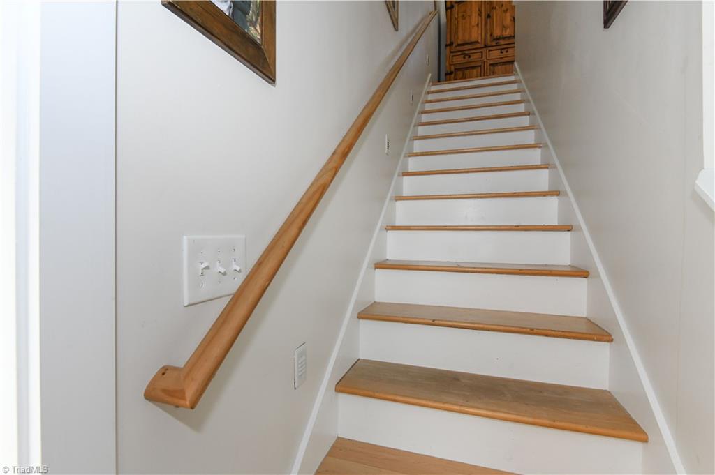 7164 Ludgate Road Gibsonville, NC 27249 - Photo 17 of 50 stairs to loft with primary bedroom