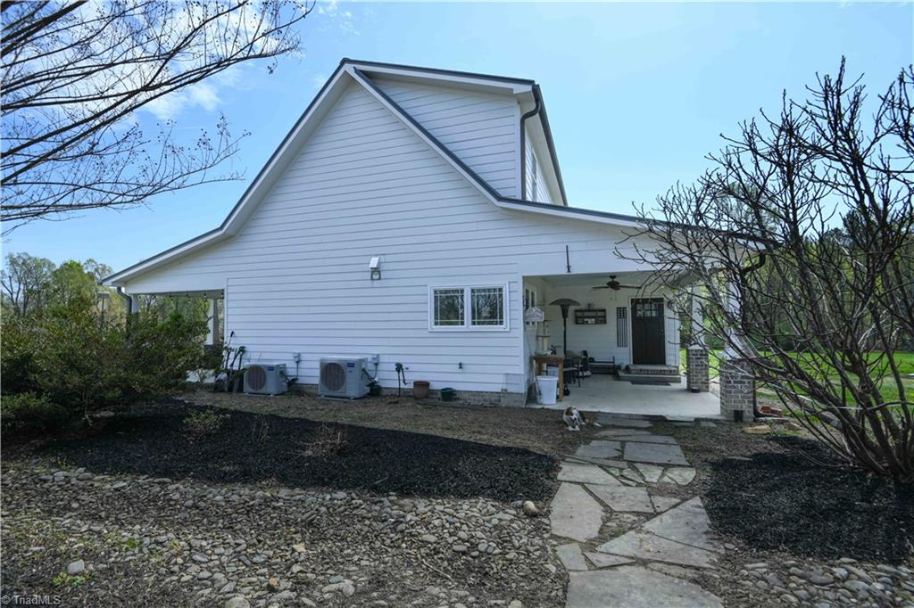 7164 Ludgate Road Gibsonville, NC 27249 - Photo 25 of 50 covered back porch