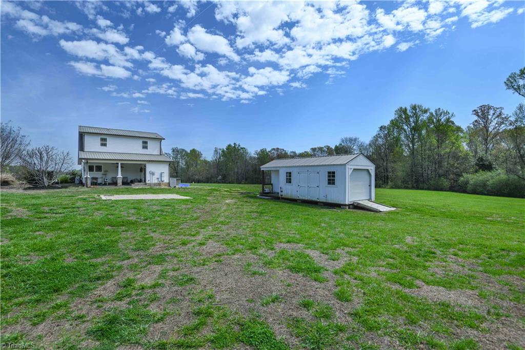 7164 Ludgate Road Gibsonville, NC 27249 - Photo 26 of 50 2 storage buildings and greenhouse on property