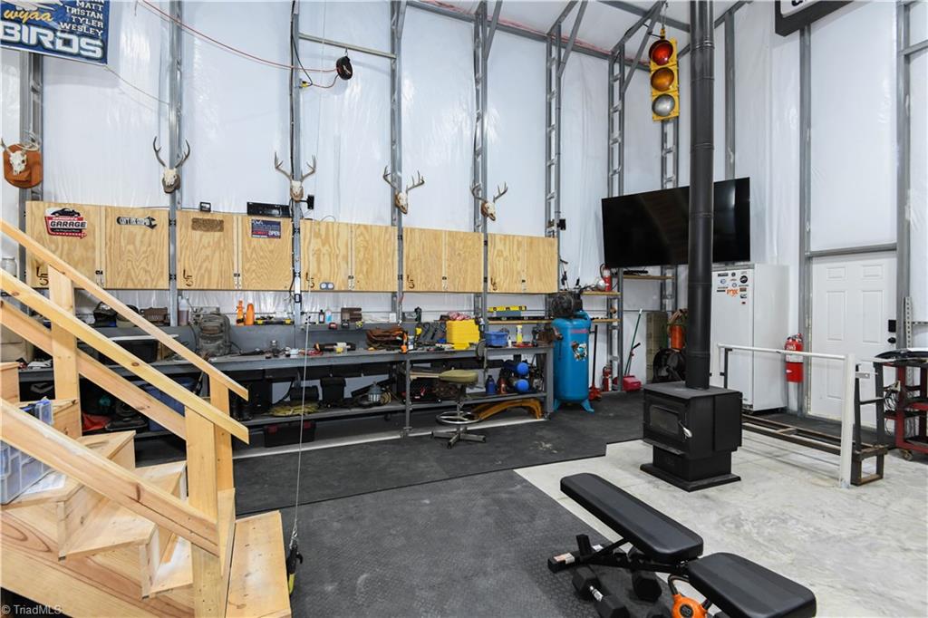 7164 Ludgate Road Gibsonville, NC 27249 - Photo 32 of 50 Main workshop space - alt view