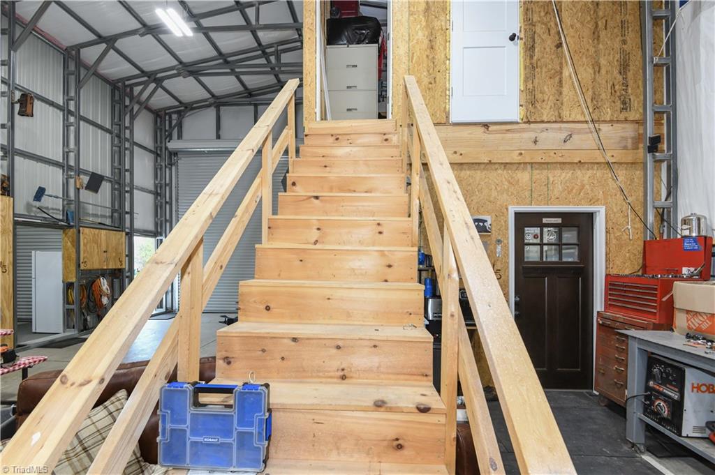 7164 Ludgate Road Gibsonville, NC 27249 - Photo 35 of 50 Stairs to upstairs storage