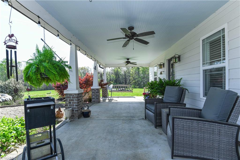 7164 Ludgate Road Gibsonville, NC 27249 - Photo 6 of 50 Covered Porch