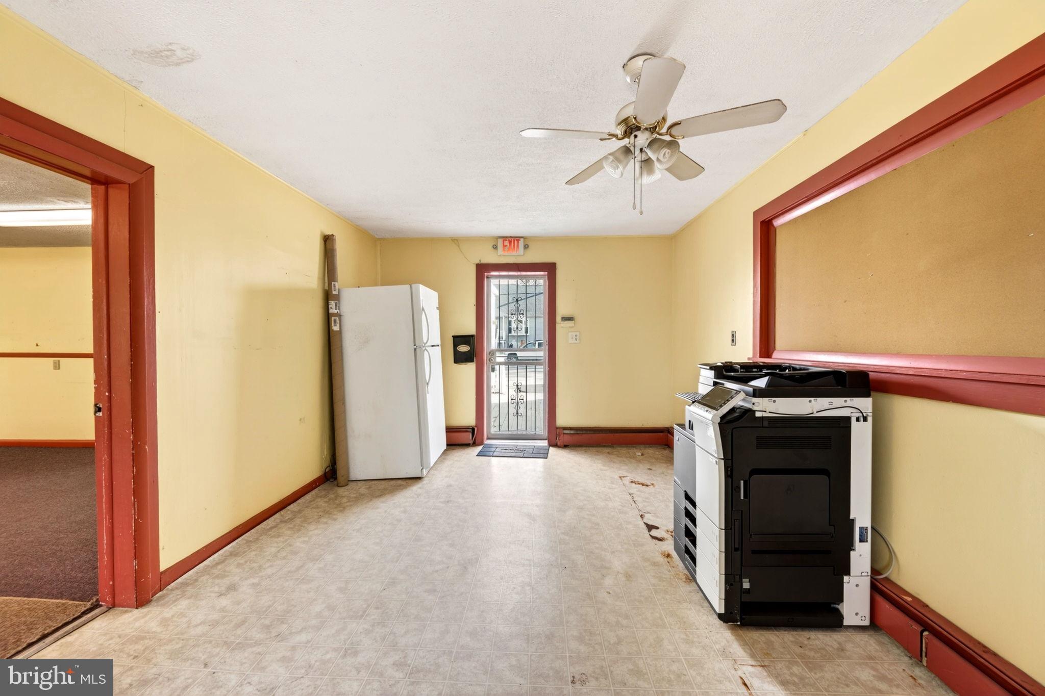 131 Midland Road Glen Burnie, MD 21060 - Photo 16 of 44 a view of a kitchen with a sink and a refrigerator
