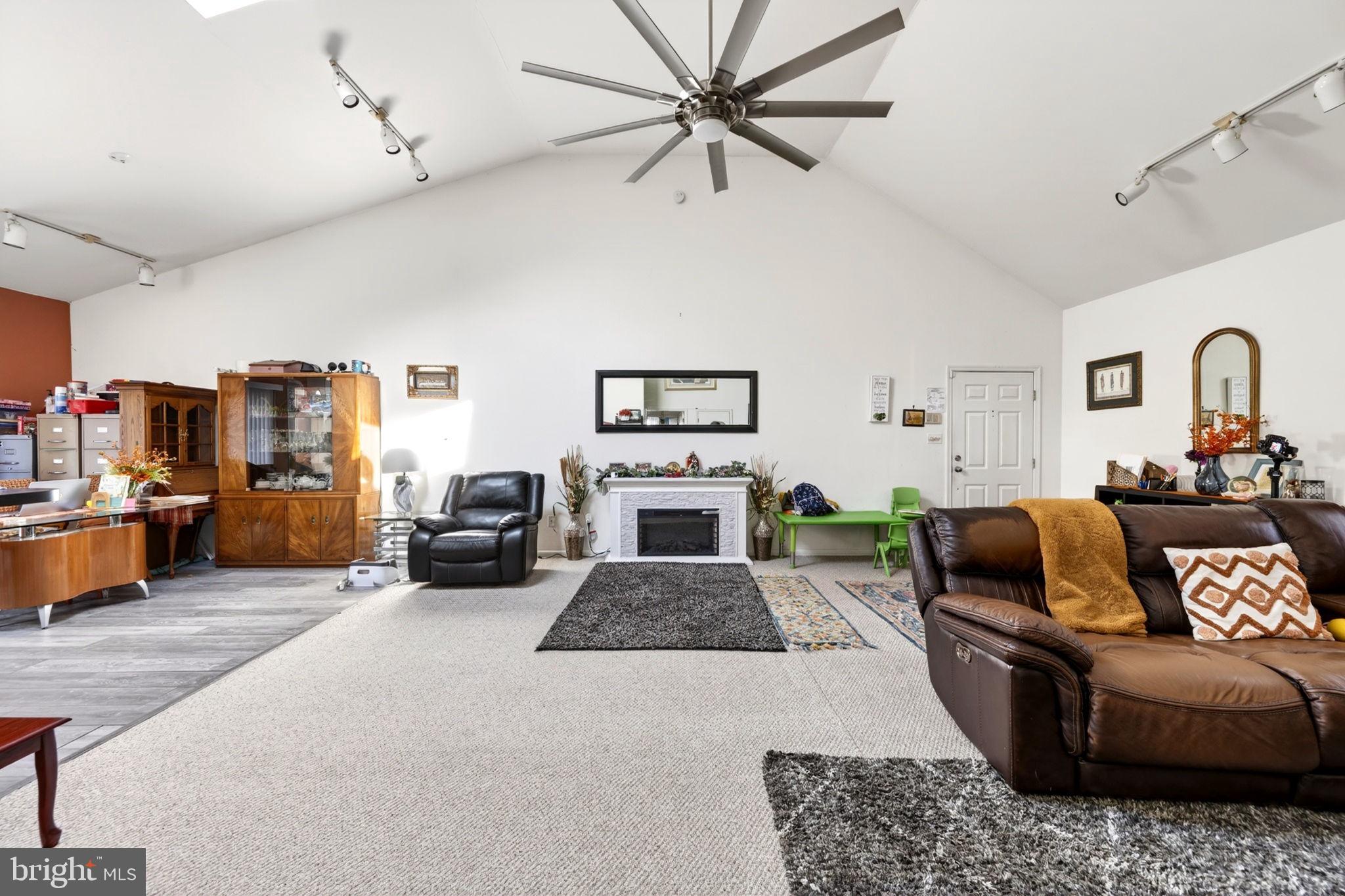 131 Midland Road Glen Burnie, MD 21060 - Photo 23 of 44 a living room with furniture and a flat screen tv