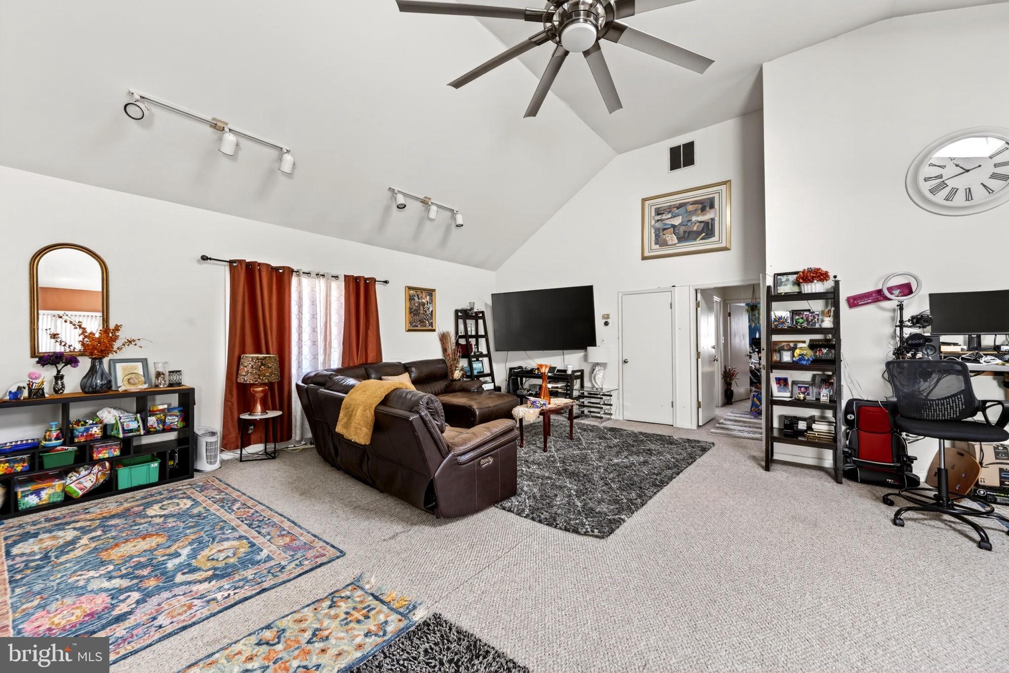 131 Midland Road Glen Burnie, MD 21060 - Photo 25 of 44 a living room with furniture and a flat screen tv