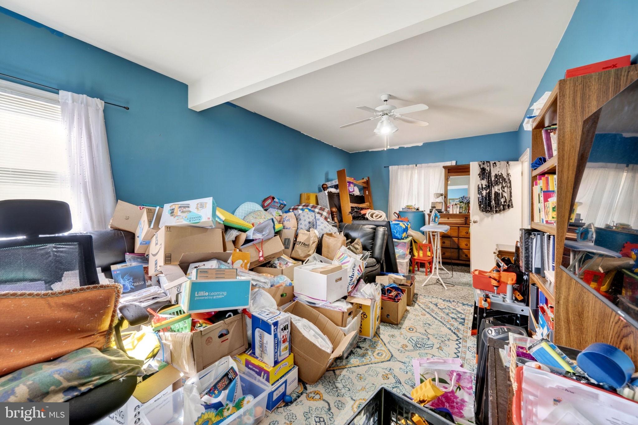 131 Midland Road Glen Burnie, MD 21060 - Photo 27 of 44 a group of people sitting in a living room