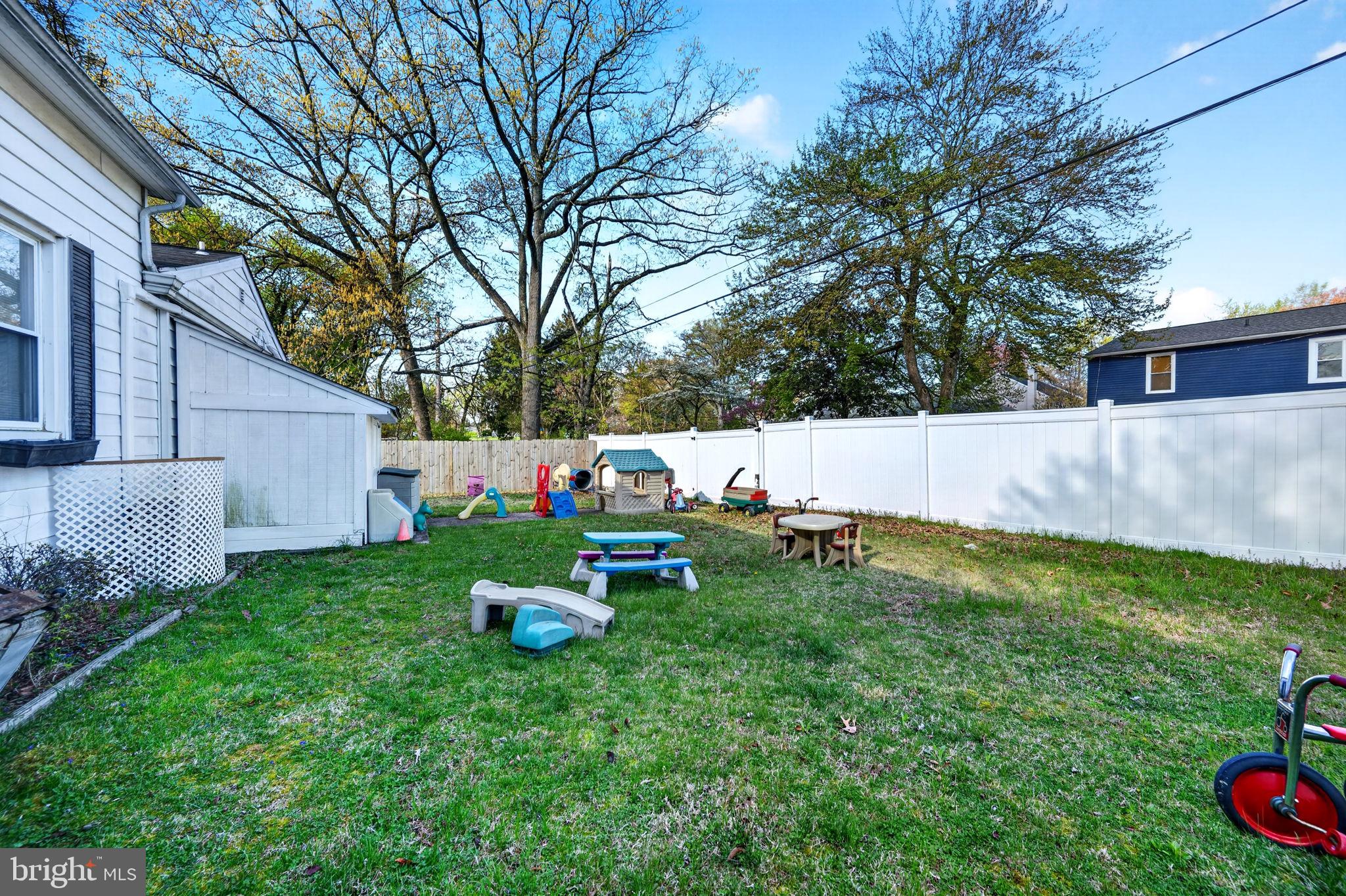 131 Midland Road Glen Burnie, MD 21060 - Photo 28 of 44 a backyard of a house with table and chairs