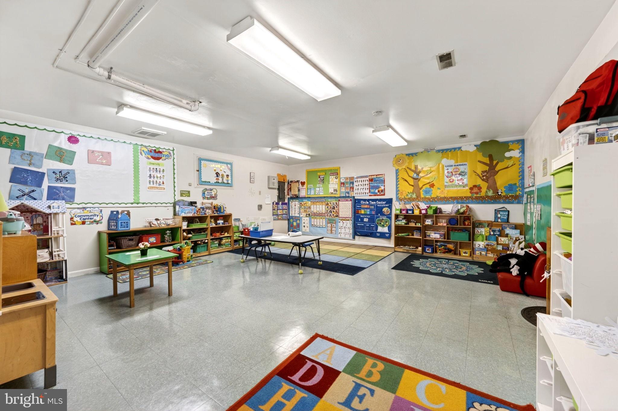 131 Midland Road Glen Burnie, MD 21060 - Photo 33 of 44 a living room with furniture and a flat screen tv