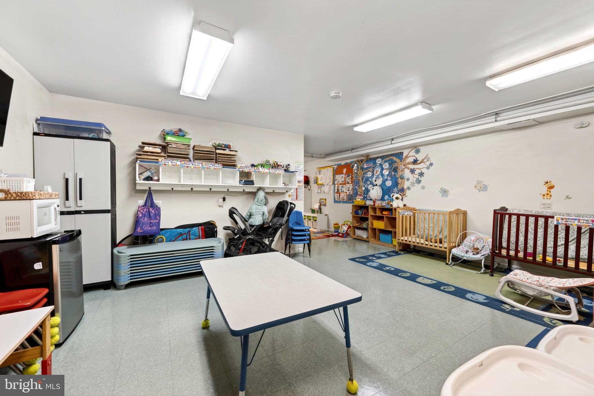 131 Midland Road Glen Burnie, MD 21060 - Photo 38 of 44 a living room with furniture and a flat screen tv