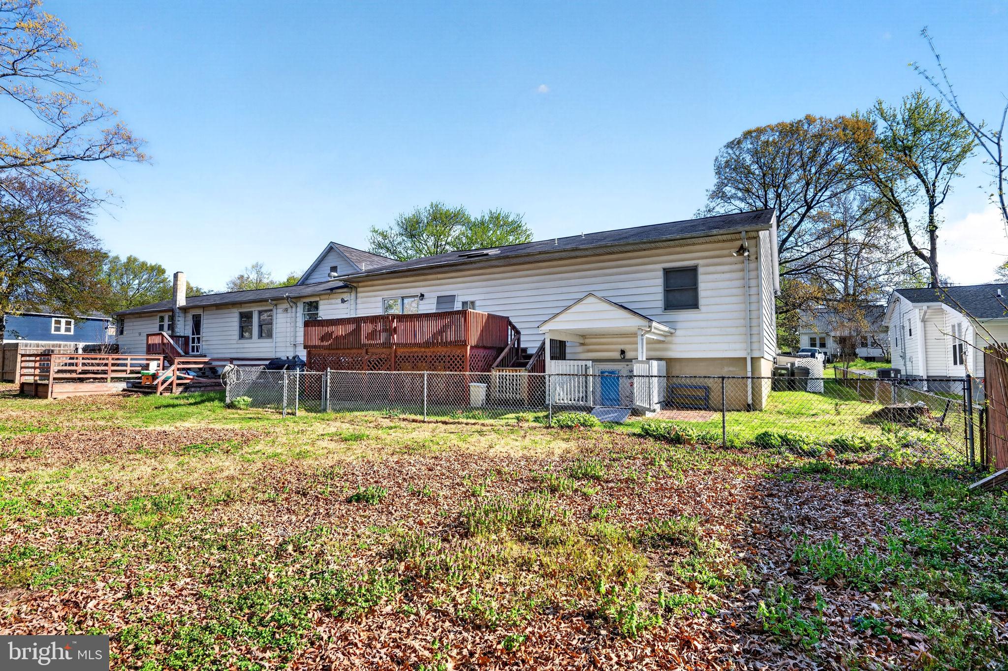 131 Midland Road Glen Burnie, MD 21060 - Photo 42 of 44 a view of a big house with a big yard and large trees