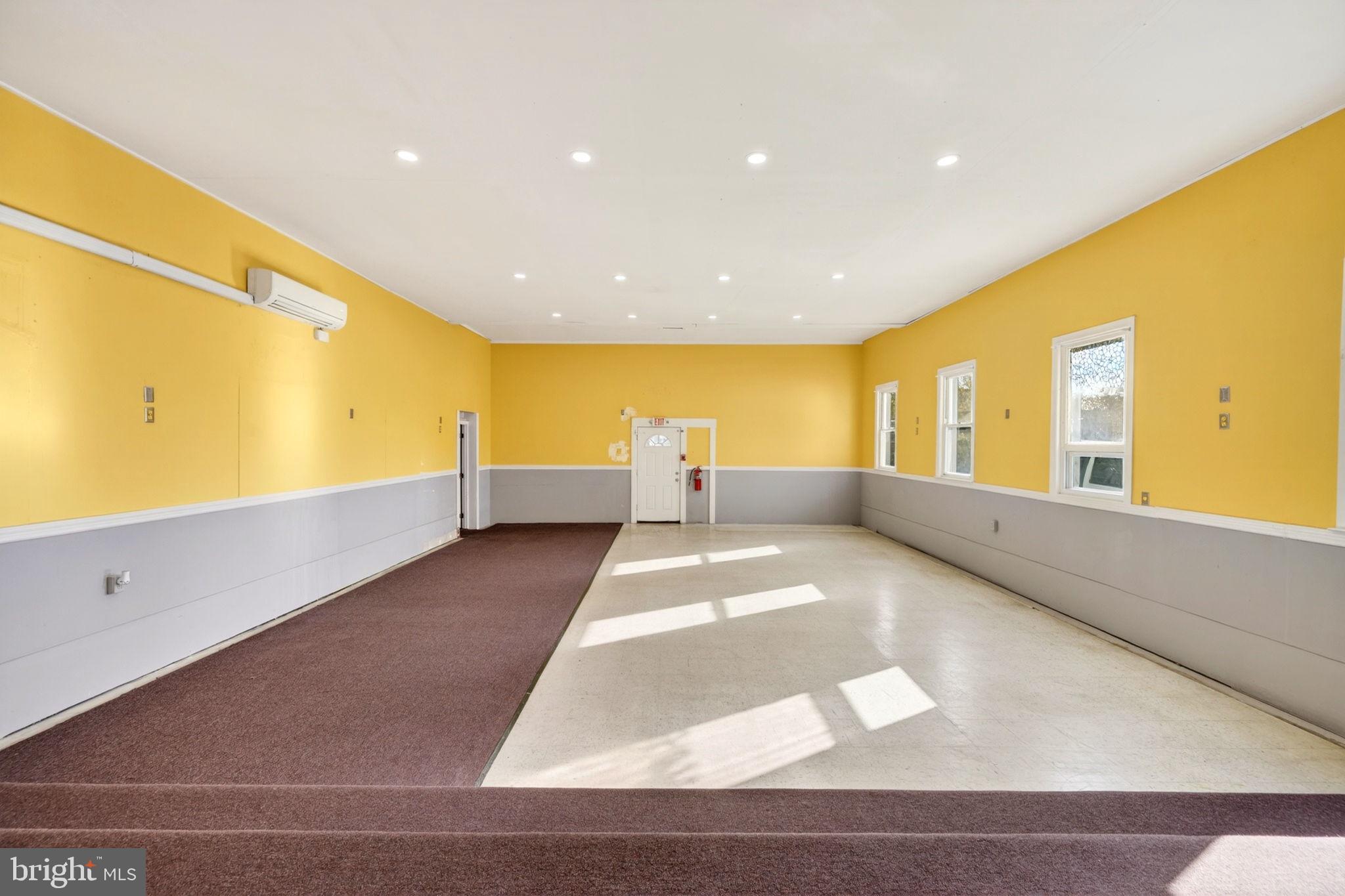 131 Midland Road Glen Burnie, MD 21060 - Photo 5 of 44 a view of an empty room with windows