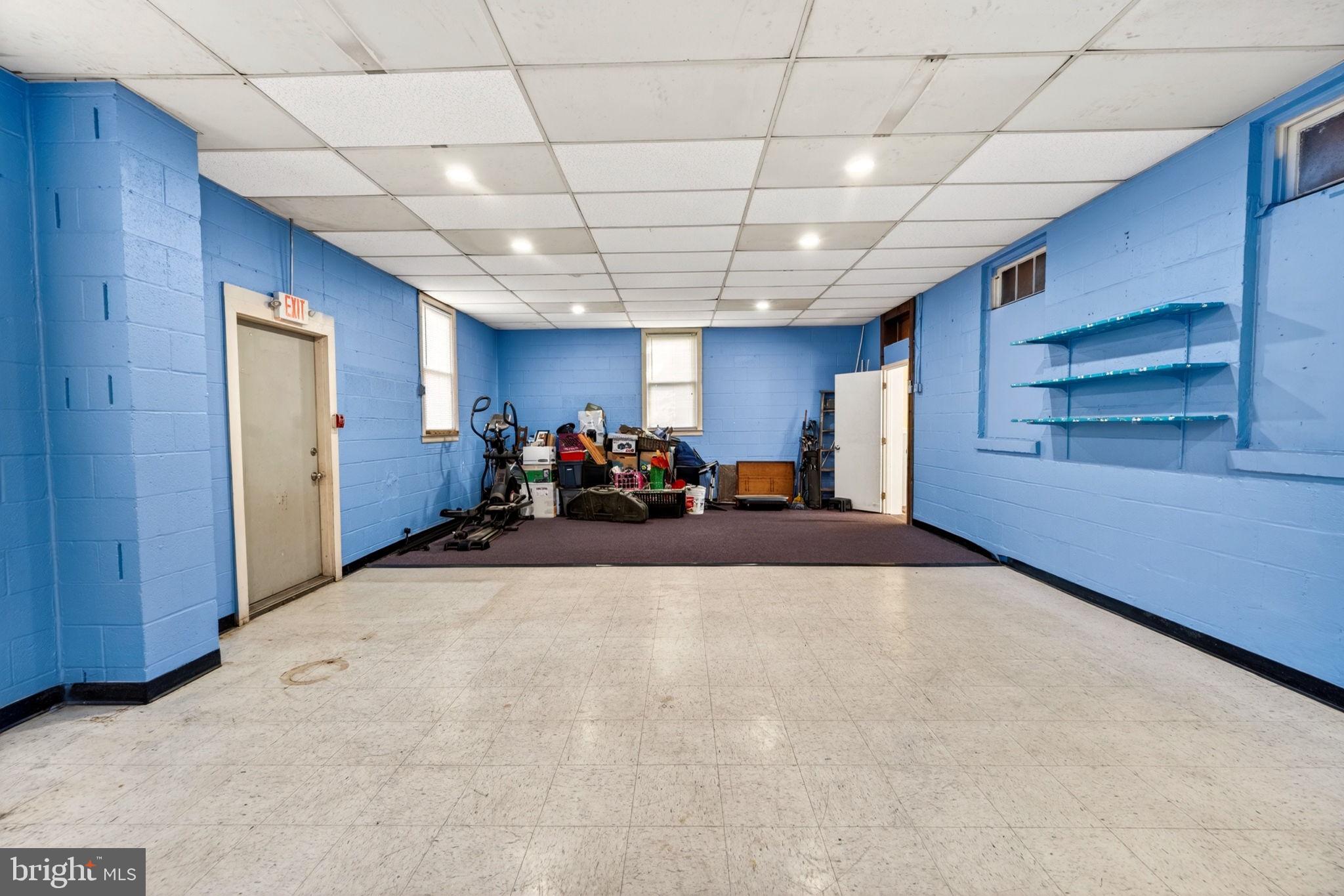 131 Midland Road Glen Burnie, MD 21060 - Photo 6 of 44 a large room with gym equipment