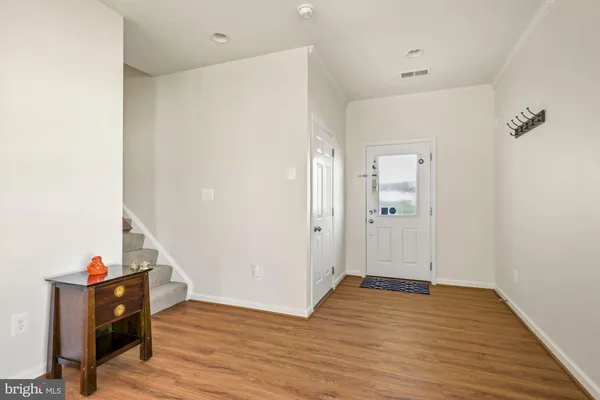 a view of entryway with wooden floor