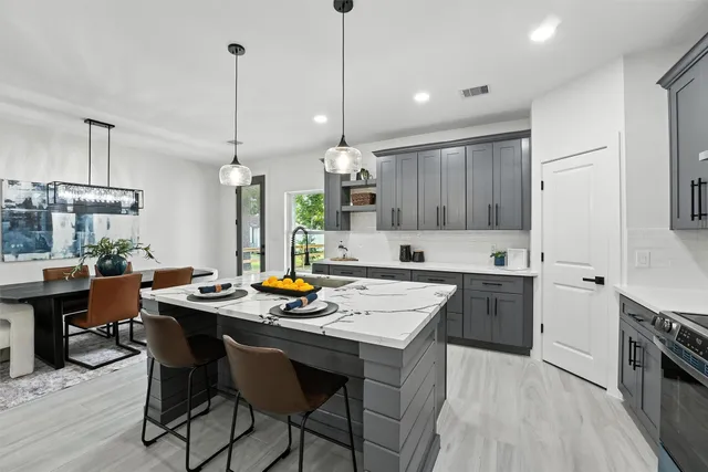 a kitchen with a table and chairs in it