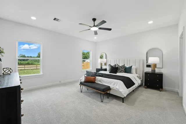 a bed room with a bed and a chandelier