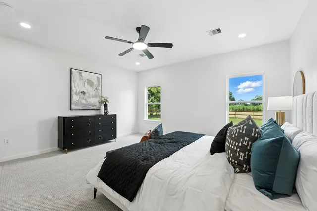 a bedroom with a bed and window