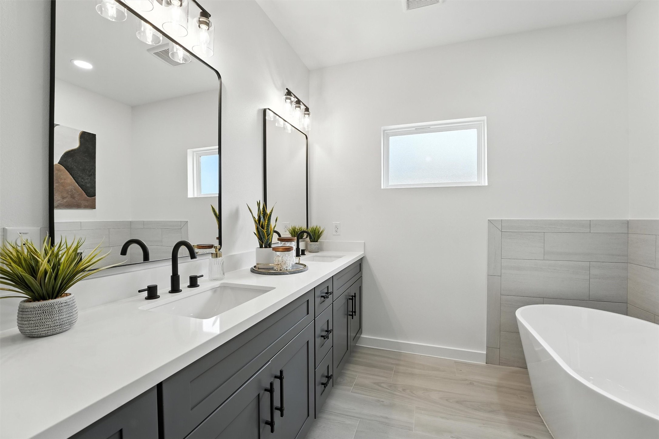 252 Davis Bend Road Alvin, TX 77511 - Photo 17 of 32 a bathroom with a double vanity sink a large mirror and shower