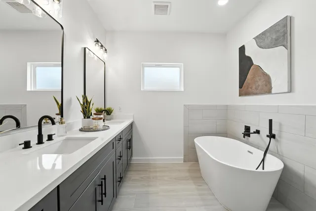 a bathroom with a bathtub and sink