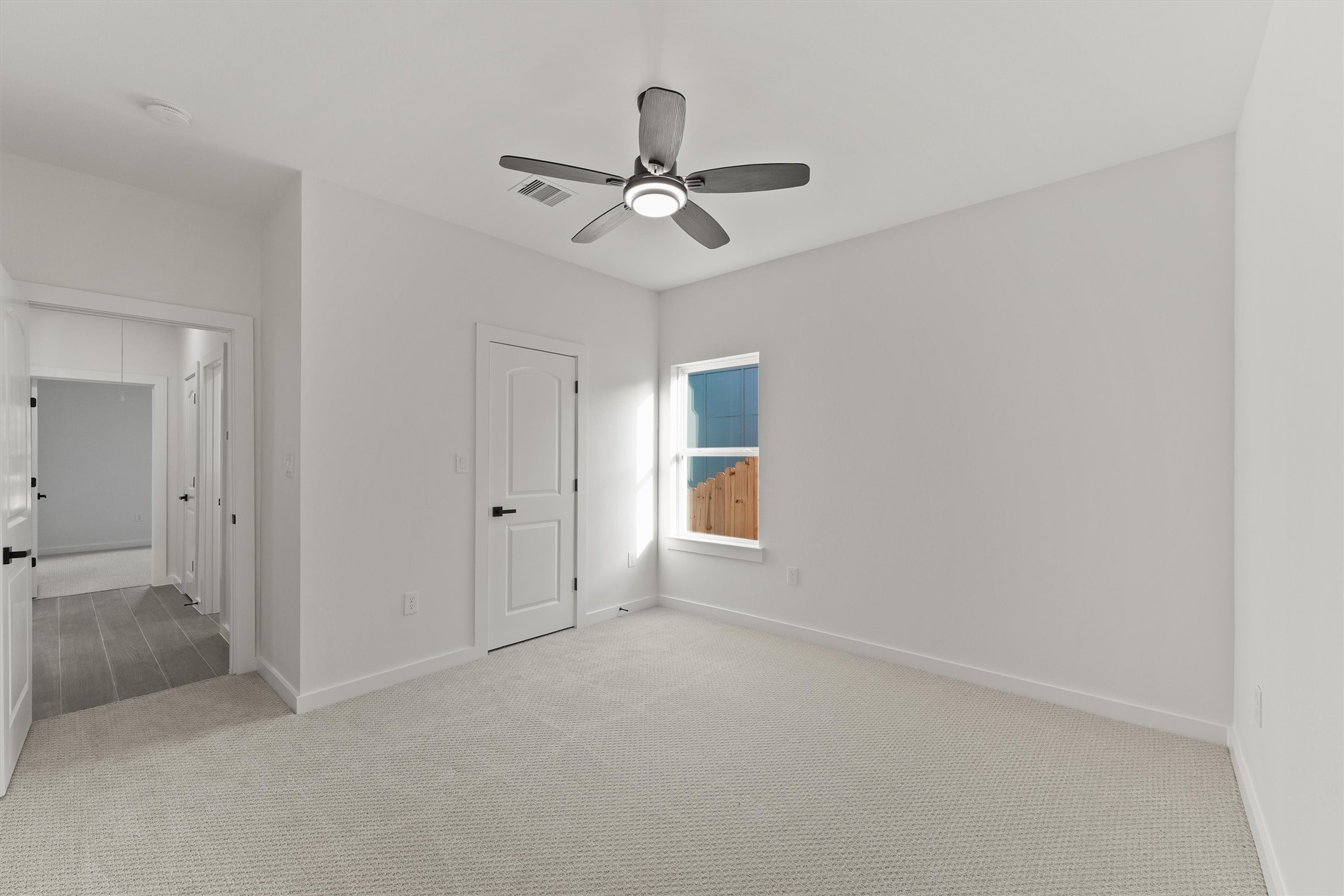 252 Davis Bend Road Alvin, TX 77511 - Photo 22 of 32 an empty room with windows and fan