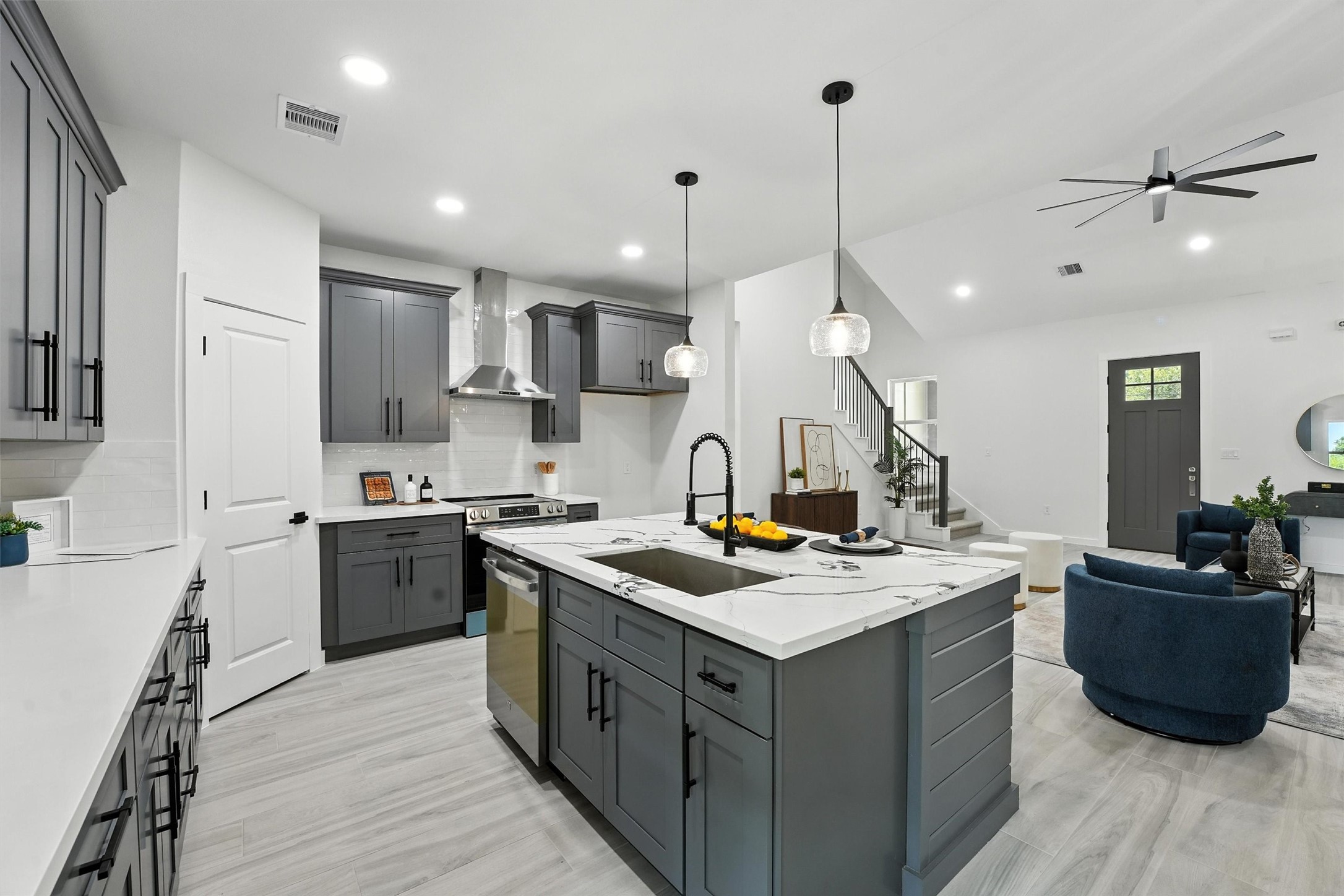 252 Davis Bend Road Alvin, TX 77511 - Photo 10 of 32 a kitchen with a sink a counter top space and stainless steel appliances