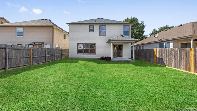 a front view of a house with a yard and porch
