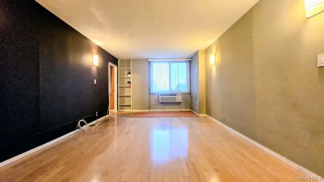 a view of an empty room and window