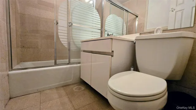 a bathroom with a toilet and a sink