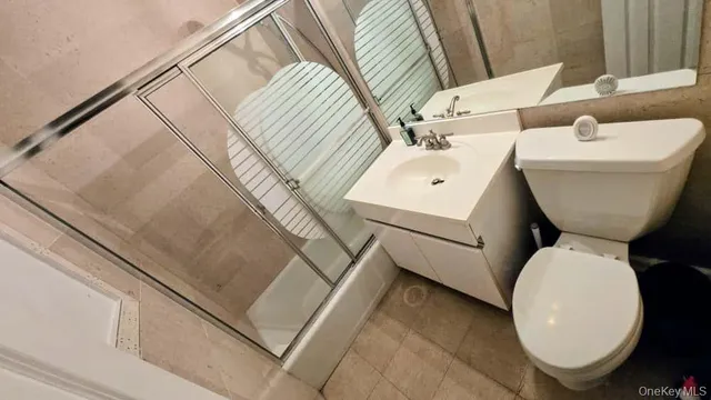 a view of hallway with closet and a window