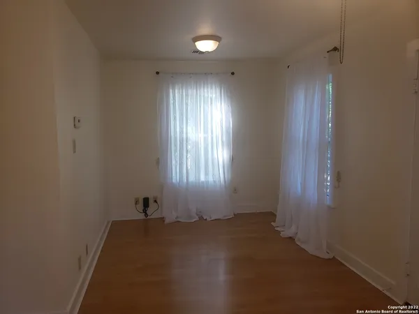 a kitchen with a sink cabinets and window