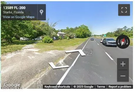 a view of a garage with a car parked