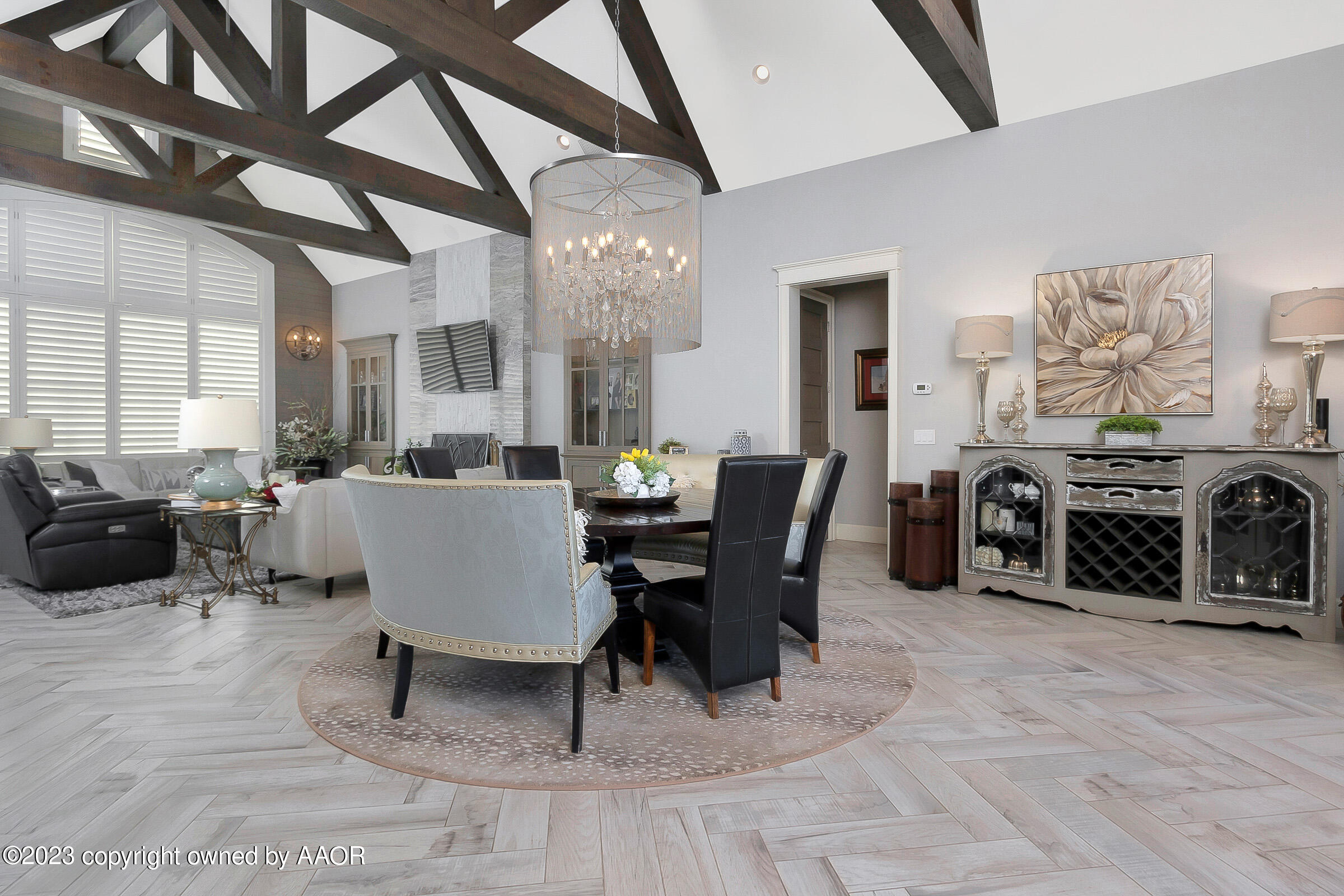 8100 Georgetown Drive Amarillo, TX 79119 - Photo 14 of 56 a living room with furniture a chandelier and a dining table