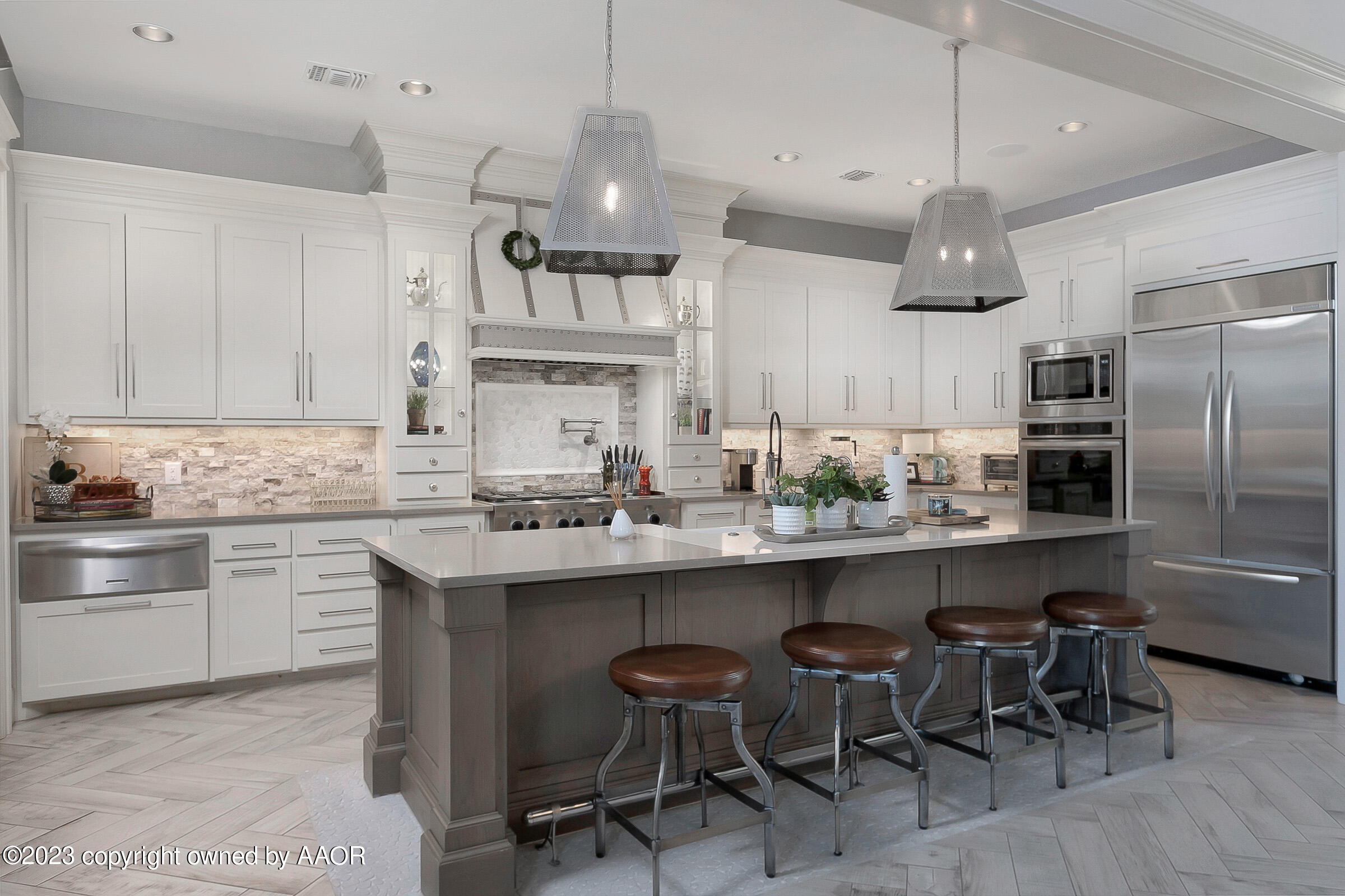 8100 Georgetown Drive Amarillo, TX 79119 - Photo 16 of 56 a kitchen with cabinets a sink stainless steel appliances and chairs