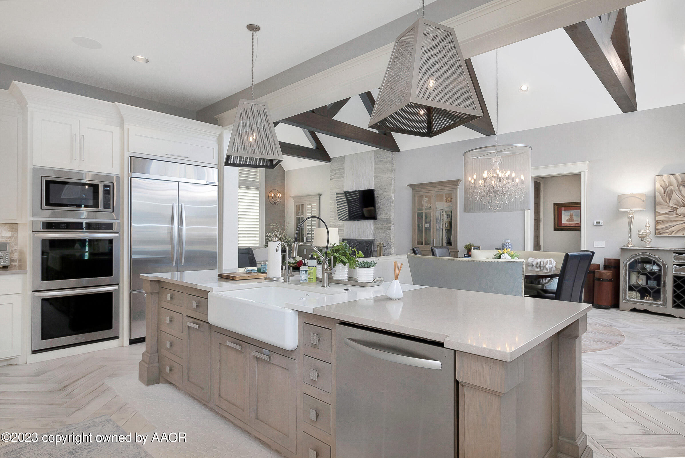 8100 Georgetown Drive Amarillo, TX 79119 - Photo 20 of 56 a kitchen with stainless steel appliances kitchen island granite countertop a refrigerator and a sink
