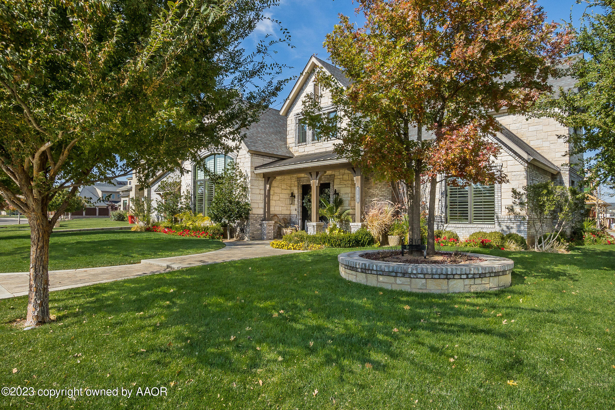 8100 Georgetown Drive Amarillo, TX 79119 - Photo 2 of 56 a front view of a house with a yard