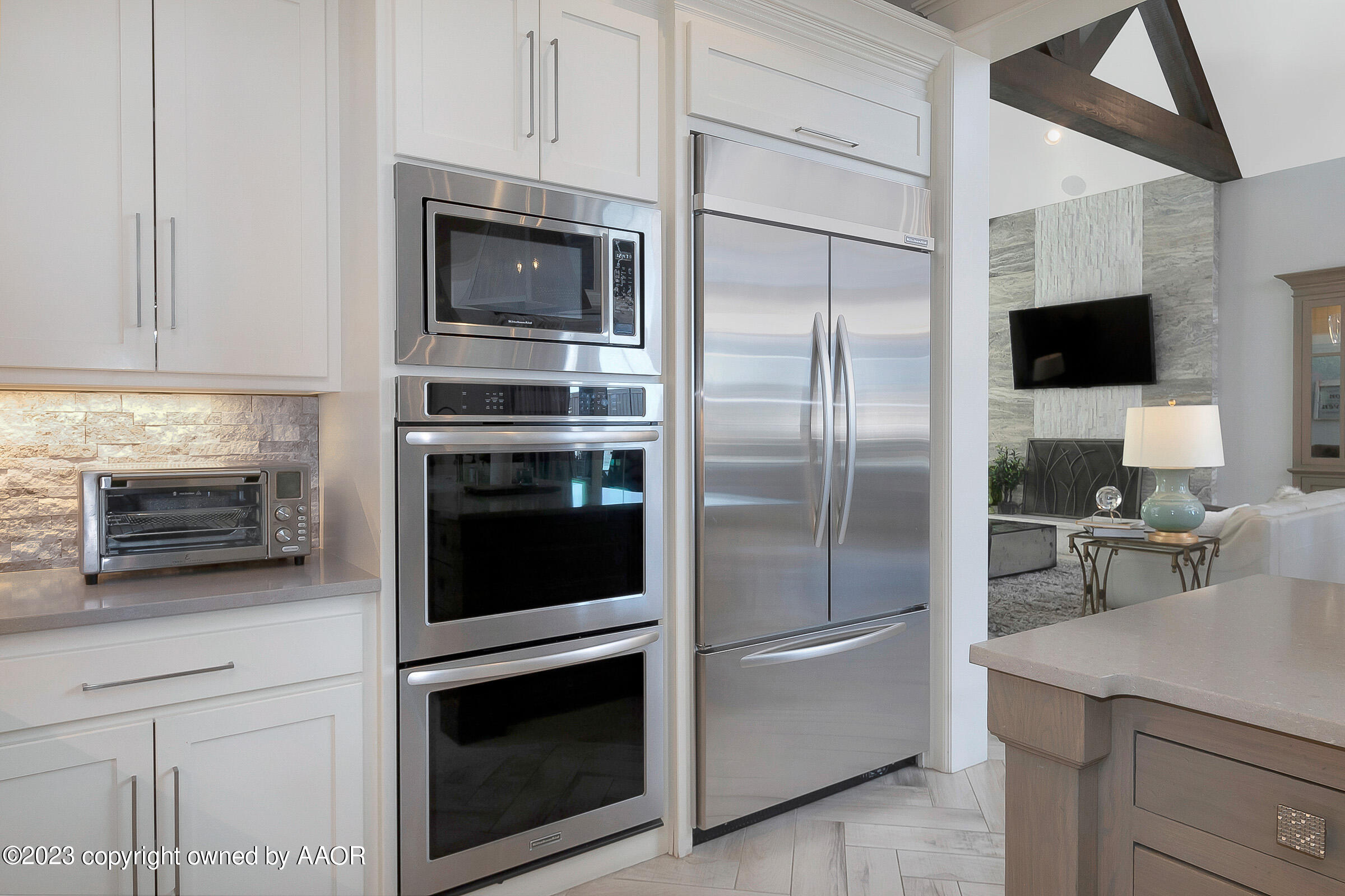 8100 Georgetown Drive Amarillo, TX 79119 - Photo 21 of 56 a kitchen with a refrigerator stove and microwave