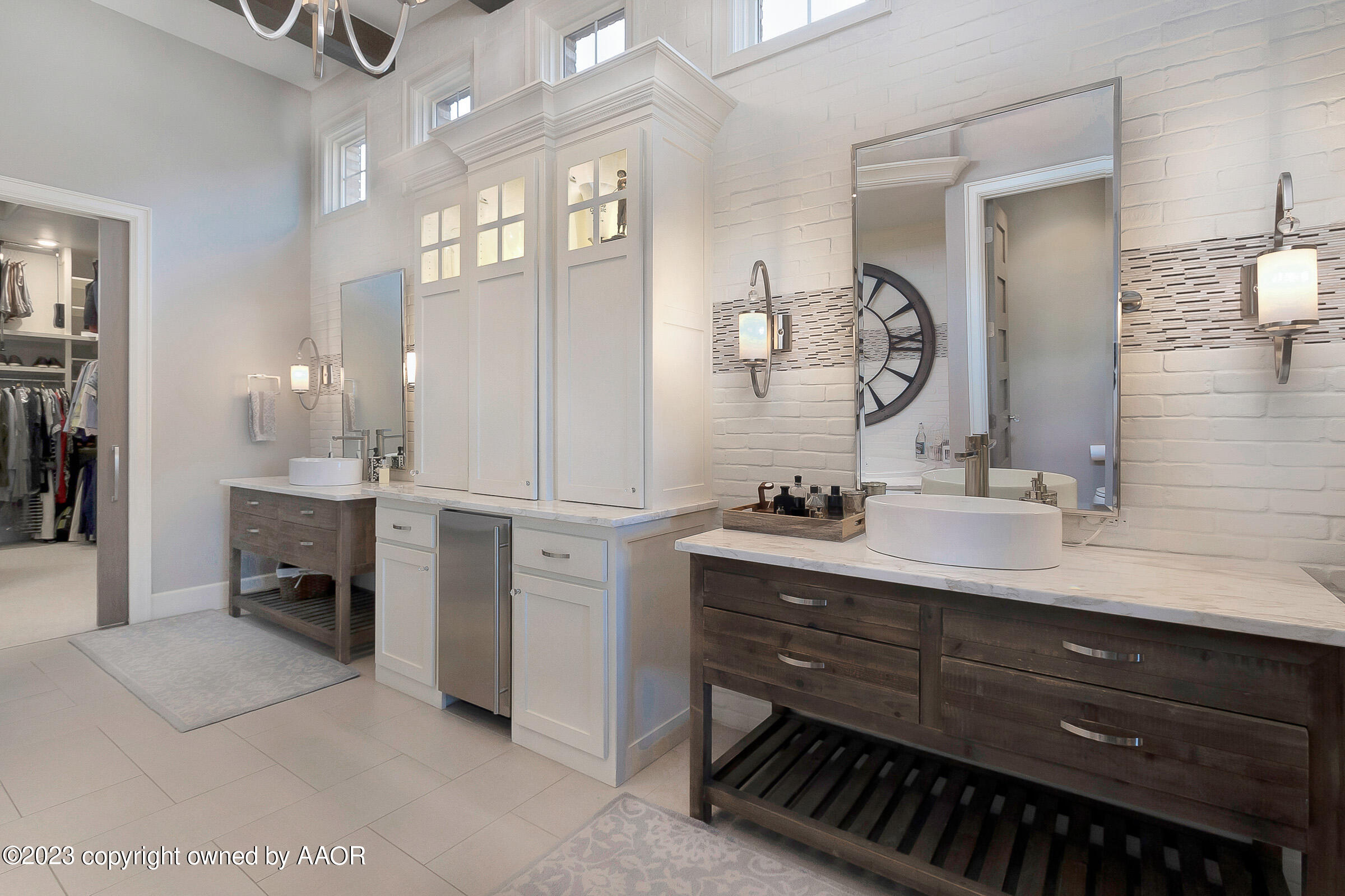 8100 Georgetown Drive Amarillo, TX 79119 - Photo 28 of 56 a bathroom with a double vanity sink and a mirror