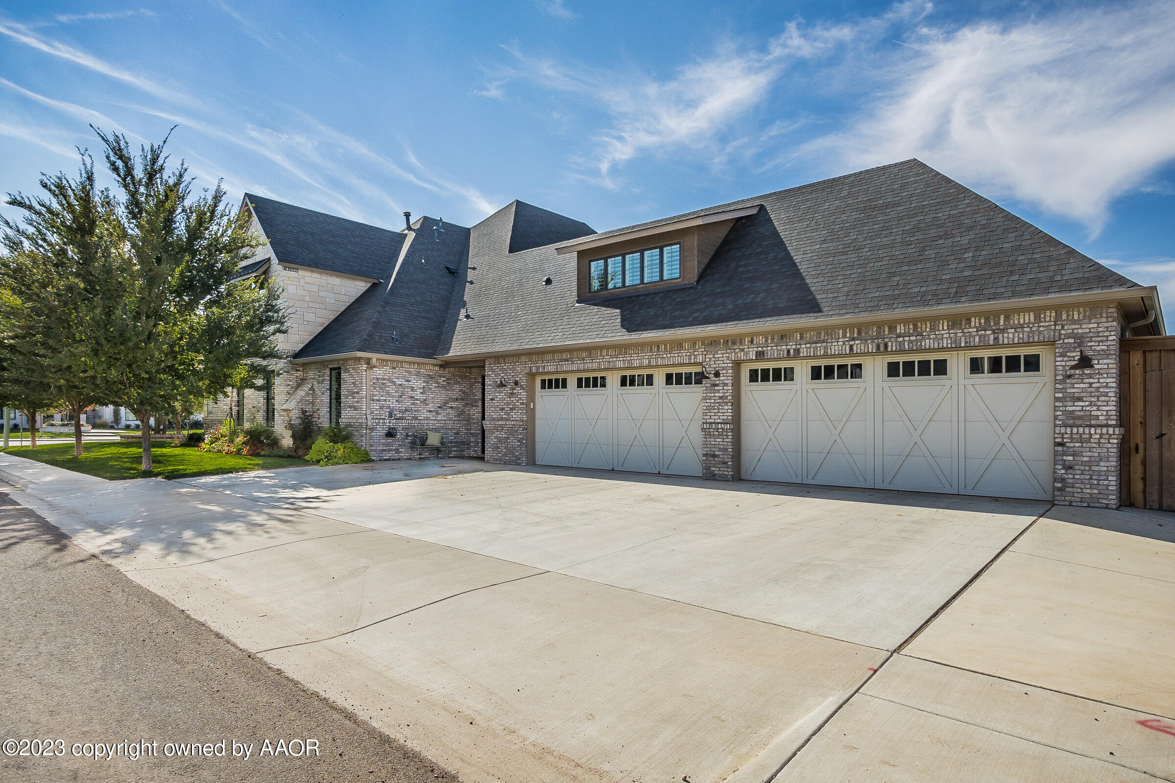 8100 Georgetown Drive Amarillo, TX 79119 - Photo 56 of 56 a front view of a house with a yard and garage