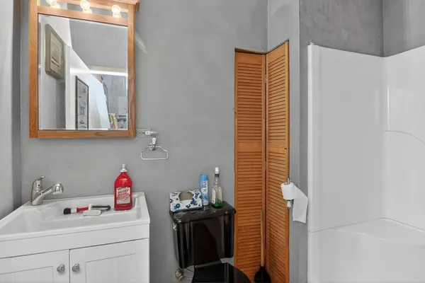 a bathroom with a sink and a washer dryer