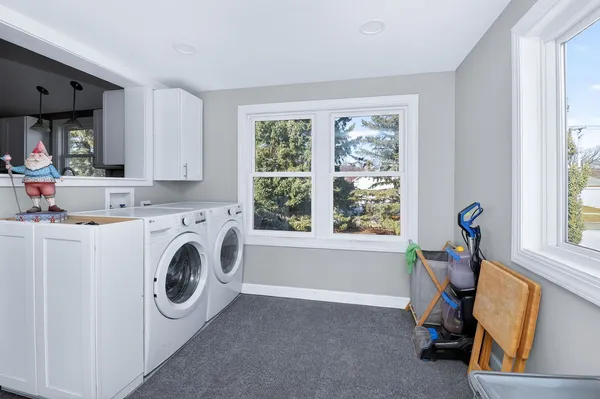 a view of livingroom with washer and dryer