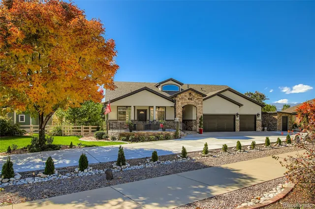 a view of a house with swimming pool and a yard
