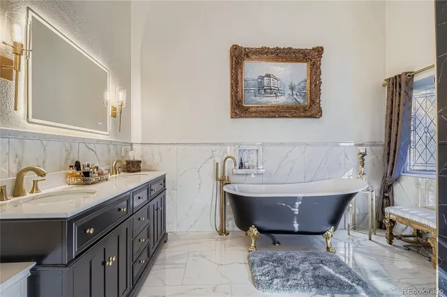 a bathroom with a bathtub and a sink