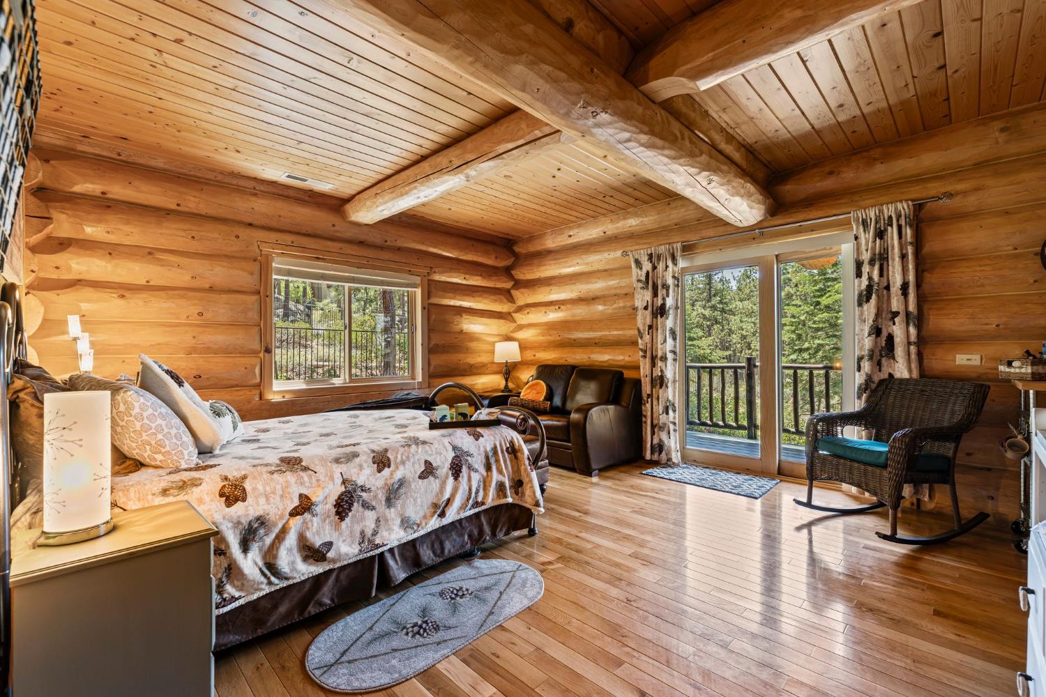 3589 Rocky Point Road South Lake Tahoe, CA 96150 - Photo 20 of 95 a bedroom with a bed and large windows