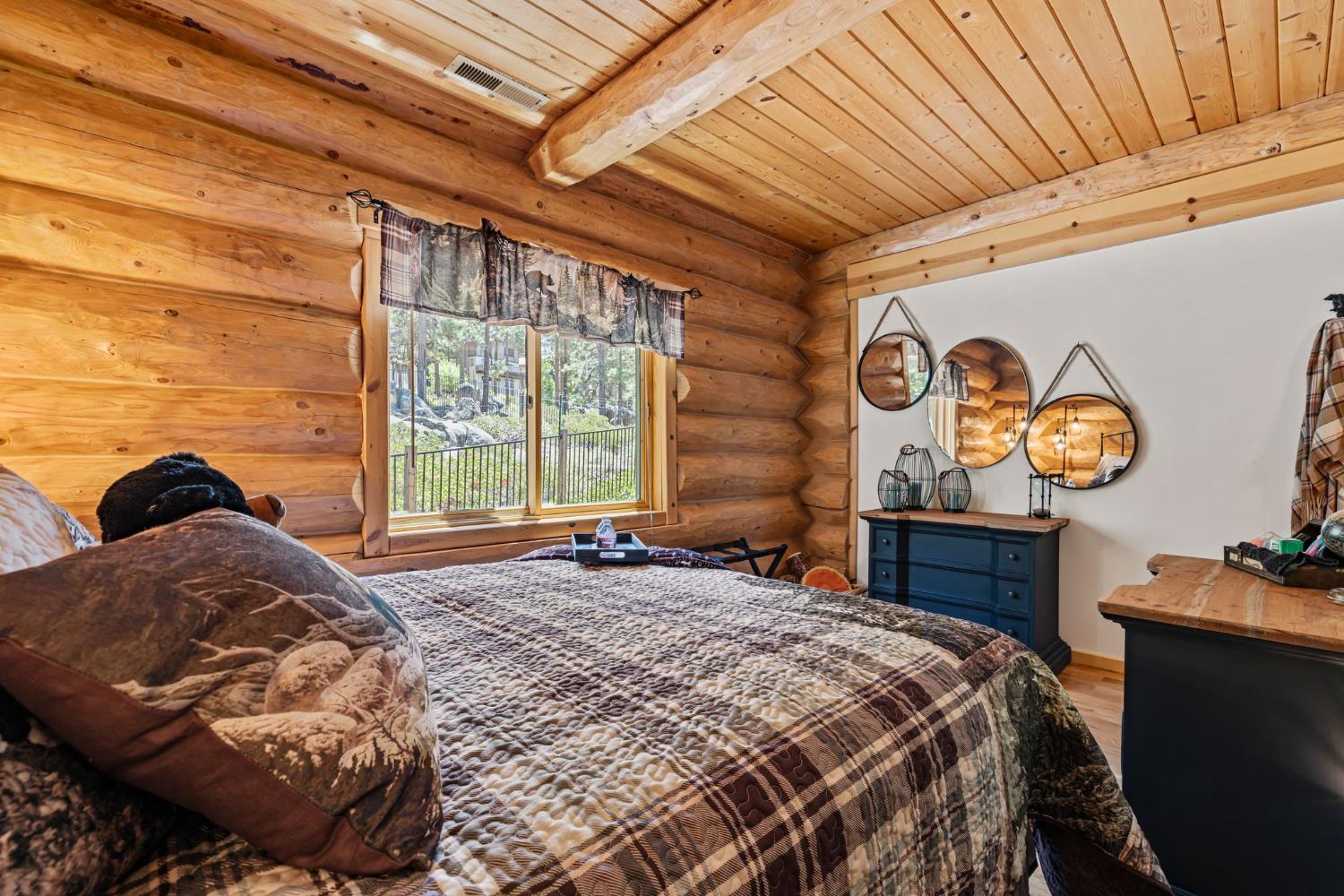 3589 Rocky Point Road South Lake Tahoe, CA 96150 - Photo 28 of 95 a bedroom with a bed and a window