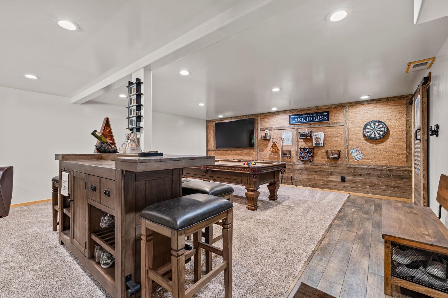 3589 Rocky Point Road South Lake Tahoe, CA 96150 - Photo 47 of 95 a living room with furniture and a flat screen tv